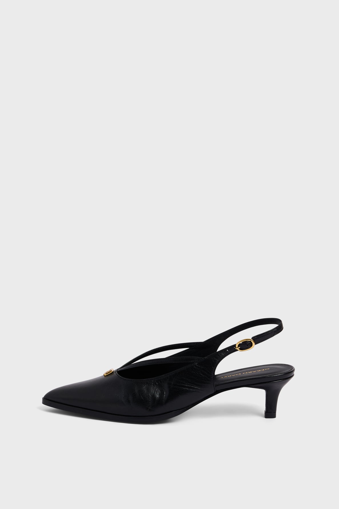 Black pointed-toe escarpins slingback heel with a small gold buckle on the ankle strap and a low micro talon, crafted in elegant cuir uni, set against a plain light gray background.