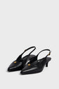 A pair of black cuir uni escarpins slingback heels with pointed toes, low micro talon kitten heels, adjustable ankle straps, and small gold embellishments on the front, displayed on a plain light gray background.