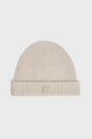 Beige knit beanie with a folded brim and a subtle raised monogramme GD logo patch on the front, displayed against a plain white background.