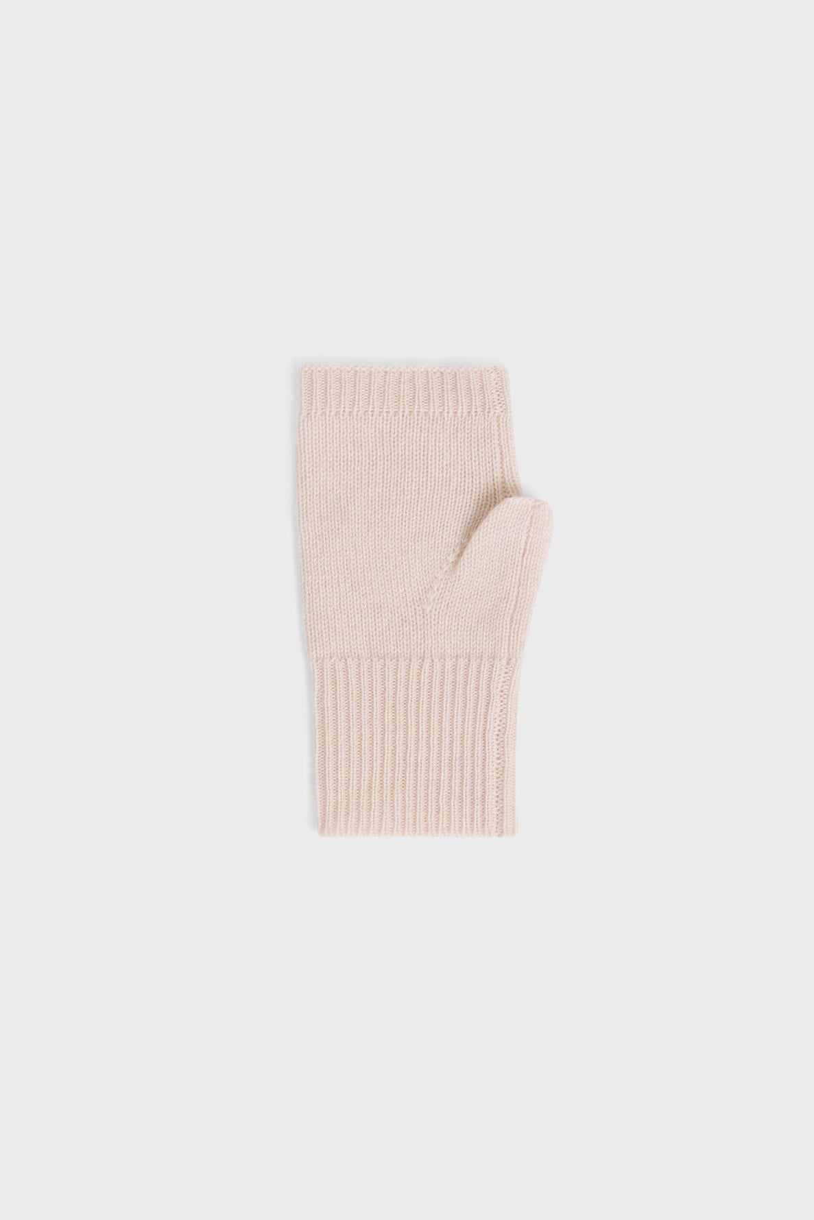 A single beige, fingerless knit glove, reminiscent of classic mitaines, is shown flat against a plain, light gray background.