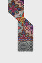 A colorful, patterned foulard rectangulaire with geometric and floral designs in pink, purple, red, and green, ending in a gray section with a fringe and a subtle diamond pattern.