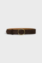 A brown cuir velours belt with a large, round gold buckle displayed against a plain white background, perfect for those who appreciate a ceinture minimaliste.