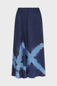 A navy blue jupe midi with a light blue tie and dye X pattern and an elastic waistband, crafted from satin imprimé and displayed on a plain white background.