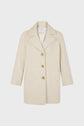 A beige manteau mi-long à chevrons, featuring three brown buttons, wide lapels, and two front pockets, displayed against a plain white background.