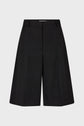 Black knee-length tailored shorts with a front zipper, belt loops, and subtle pleats, displayed on a plain light background.