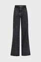 High-waisted, wide-leg black jeans with a subtle all-over motif à pois and large front pockets, displayed on a plain white background.