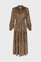 Long-sleeve midi dress with a brown and black imprimé léopard pattern, gathered waist, buttoned cuffs, and a high neckline. The skirt is tiered and flows to mid-calf length for a robe glamour-chic style. The background is white.