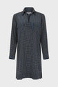 Long-sleeve shirt dress with a navy blue base and small yellow rectangular motif géométrique, featuring a collared neckline and buttoned chest pockets, displayed on a plain white background.