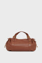 A brown leather duffel-style sac à main with gold hardware, two short handles, and gathered side details, crafted from cuir délicat and set against a plain white background.