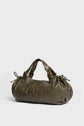 Olive green leather sac à main with gold hardware, two short handles, and gathered drawstring details on both ends, placed on a plain light background. This elegant piece showcases cuir délicat and the refined craftsmanship typical of maroquinerie Darel.