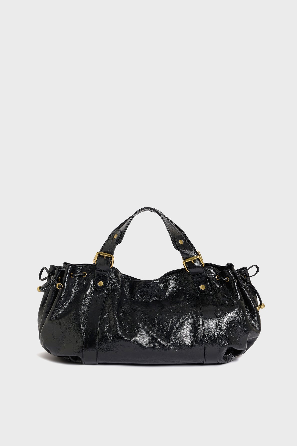 A shiny black cuir froissé leather sac à main with gold hardware, short handles, buckle details, and gathered sides, displayed against a plain white background.
