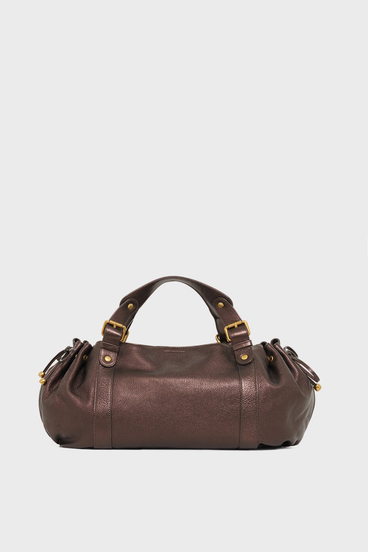 A brown cuir de chèvre sac à main with two short handles, gold-tone hardware, and a rounded shape, exemplifying the refined elegance of maroquinerie Darel, displayed against a plain white background.