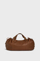 A brown sac à main duffel bag crafted from cuir délicat, featuring two short handles, drawstring details on the sides, and elegant gold hardware, displayed against a plain light background—perfect for stylish 72h getaways.