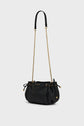 Black leather drawstring sac bandoulière by Gerard Darel, featuring gold chain and shoulder strap, gold hardware, and subtle branding displayed on the front. Crafted from luxurious cuir grainé, the bag has a soft, rounded shape and is set against a plain light background.