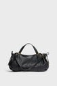 A black Gerard Darel sac à main in cuir grainé with gold hardware, dual handles, and an adjustable shoulder strap is displayed against a plain light gray background.