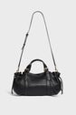 A black textured sac à main cuir handbag with two short handles and a long adjustable shoulder strap, featuring gold-tone hardware and side drawstring details, set against a plain light background.