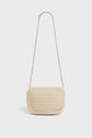 A small, rectangular beige crochet handbag with a gold chain strap, this sac fait main is displayed against a plain white background.