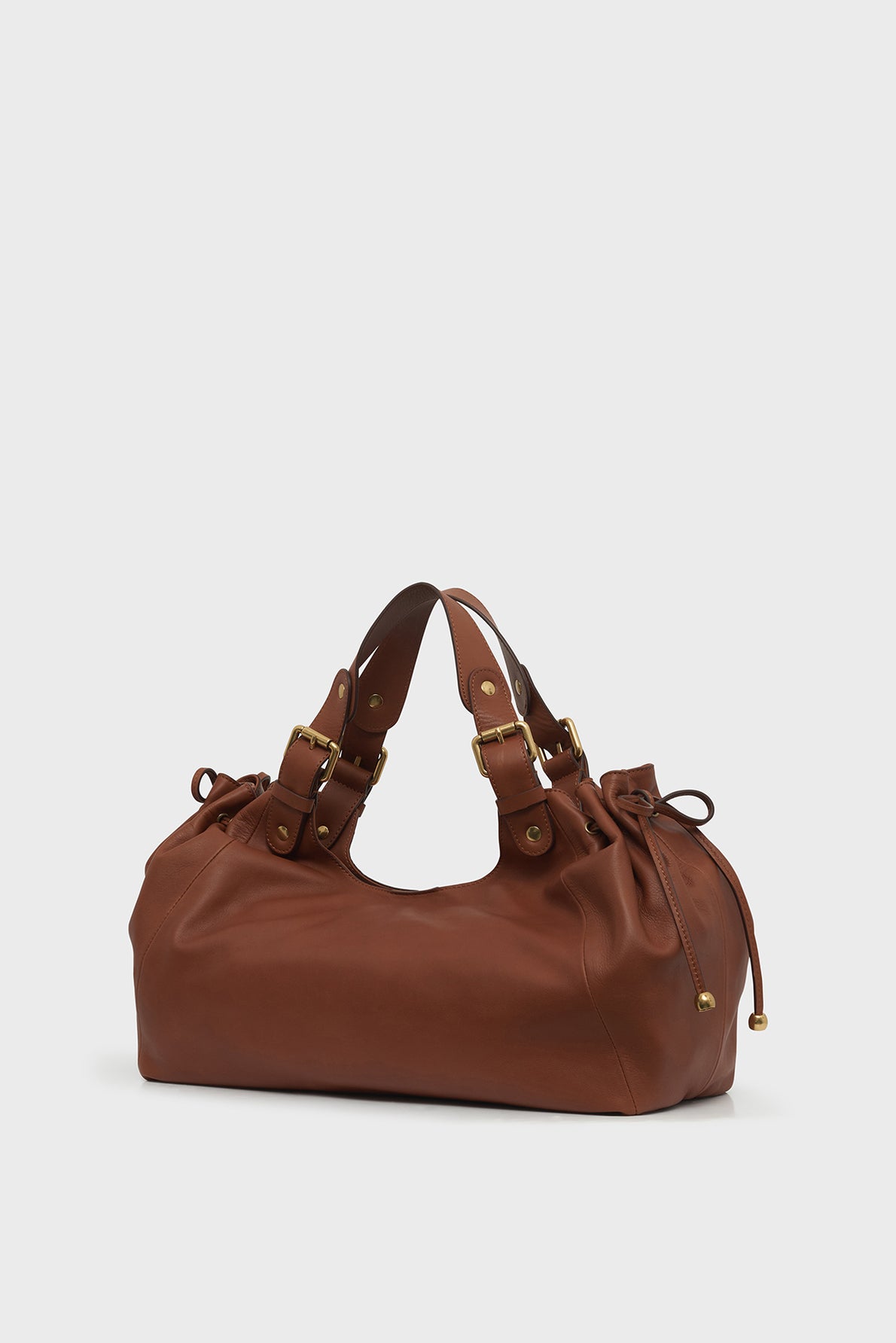 A medium-sized brown sac CHIARA GD en cuir Darel with gold hardware, double handles, and drawstring details on each side, set against a plain white background.