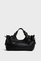 A black cuir Darel sac à main with gold hardware, two handles, and side drawstring details, set against a plain light gray background.