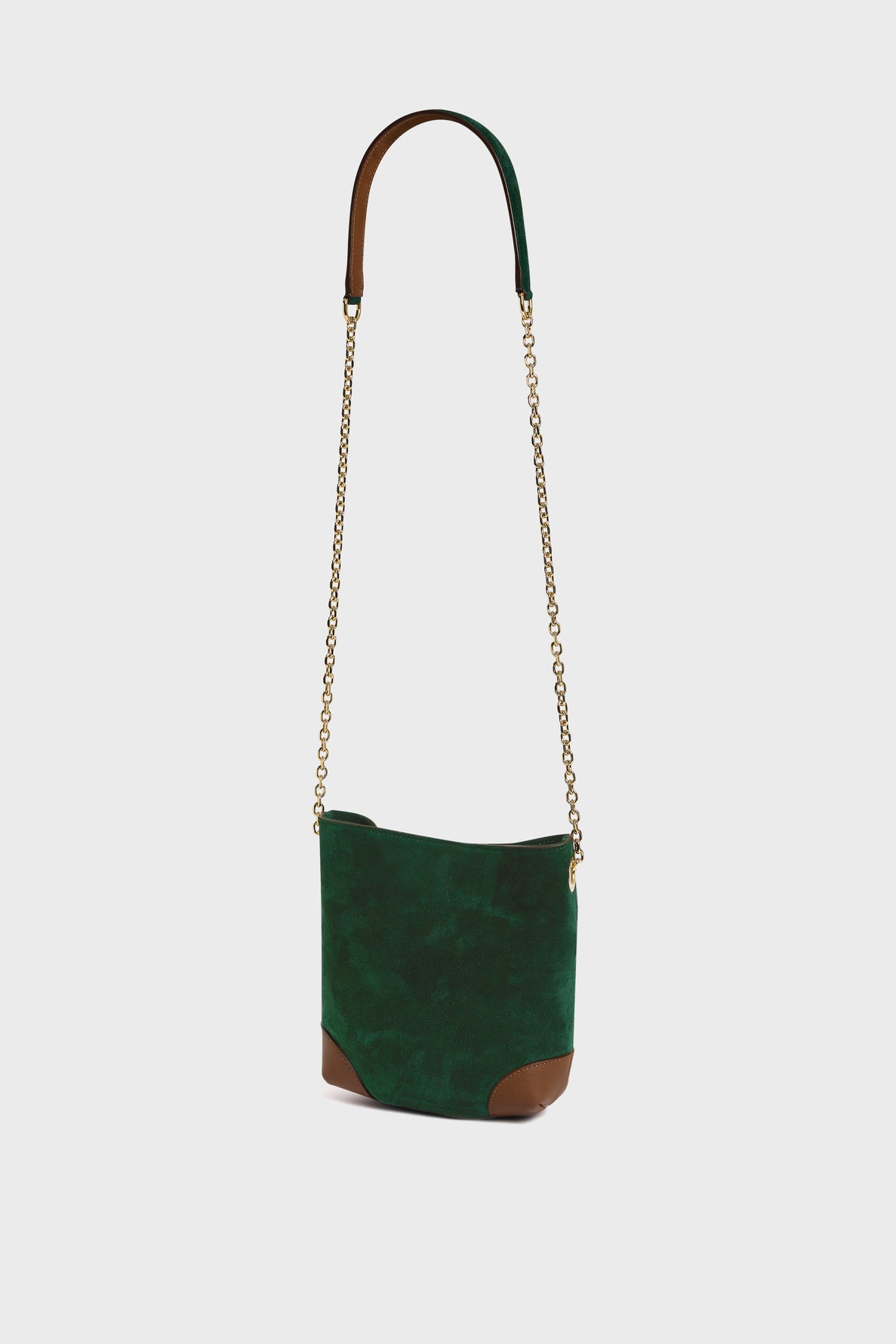 Small green suede shoulder bag, the Mini Charlotte sac bandoulière, with gold chain strap and brown leather accents on the strap and bottom corners, displayed against a plain white background. This chic piece in cuir velours combines elegance and versatility for any occasion.