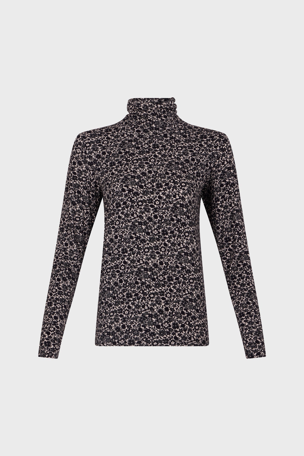 Long-sleeve turtleneck top with a black and beige allover floral pattern, displayed on a plain white background.