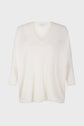 A loose-fitting, white pull oversize cachemire V-neck sweater with three-quarter length sleeves displayed on a plain white background.