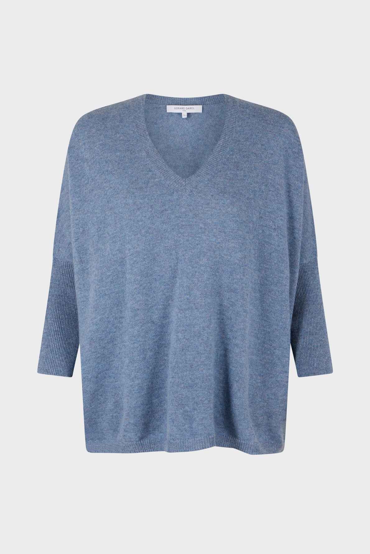 Blue V-neck sweater with three-quarter length sleeves, loose fit, and ribbed cuffs and hem, reminiscent of a stylish pull oversize cachemire, displayed on a plain white background.