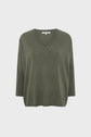Olive green pull oversize V-neck sweater with three-quarter sleeves, displayed on a plain white background. The sweater has a relaxed, loose fit and a soft, knit texture reminiscent of a poncho cachemire.
