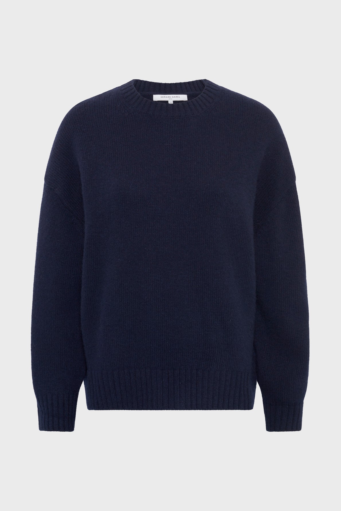 A navy blue, long-sleeve pull col rond sweater with ribbed cuffs, hem, and collar, crafted in a luxurious laine cachemire blend; displayed against a plain white background, this pull Jeannic piece offers both comfort and timeless style.