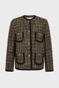 A brown plaid veste en tweed with gold buttons, black trim on the edges and pockets, and two chest and two lower front pockets. This chic veste sans col features a round neckline and long sleeves for a timeless, sophisticated look.