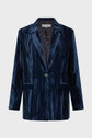 A dark blue velvet blazer with a single button closure, two front flap pockets, and a notched lapel, displayed against a plain white background.