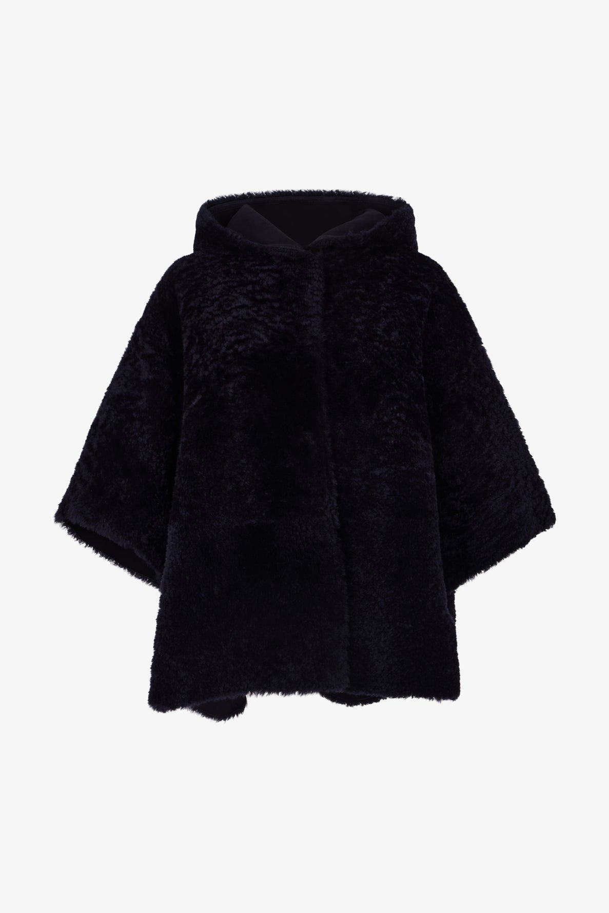 Black faux fur hooded cape with wide sleeves, displayed on a white background. Reminiscent of a classic cape peau lainée, this piece has a soft, plush texture and an oversized fit, giving it a cozy and luxurious appearance.