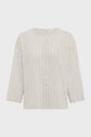 A cream-colored, long-sleeve, button-up shirt with vertical black stripes and a chest pocket, displayed on a plain white background.