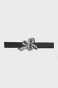 A black ceinture bijoux belt with a large, decorative bow-shaped buckle adorned with black and silver rhinestones, displayed on a plain white background.