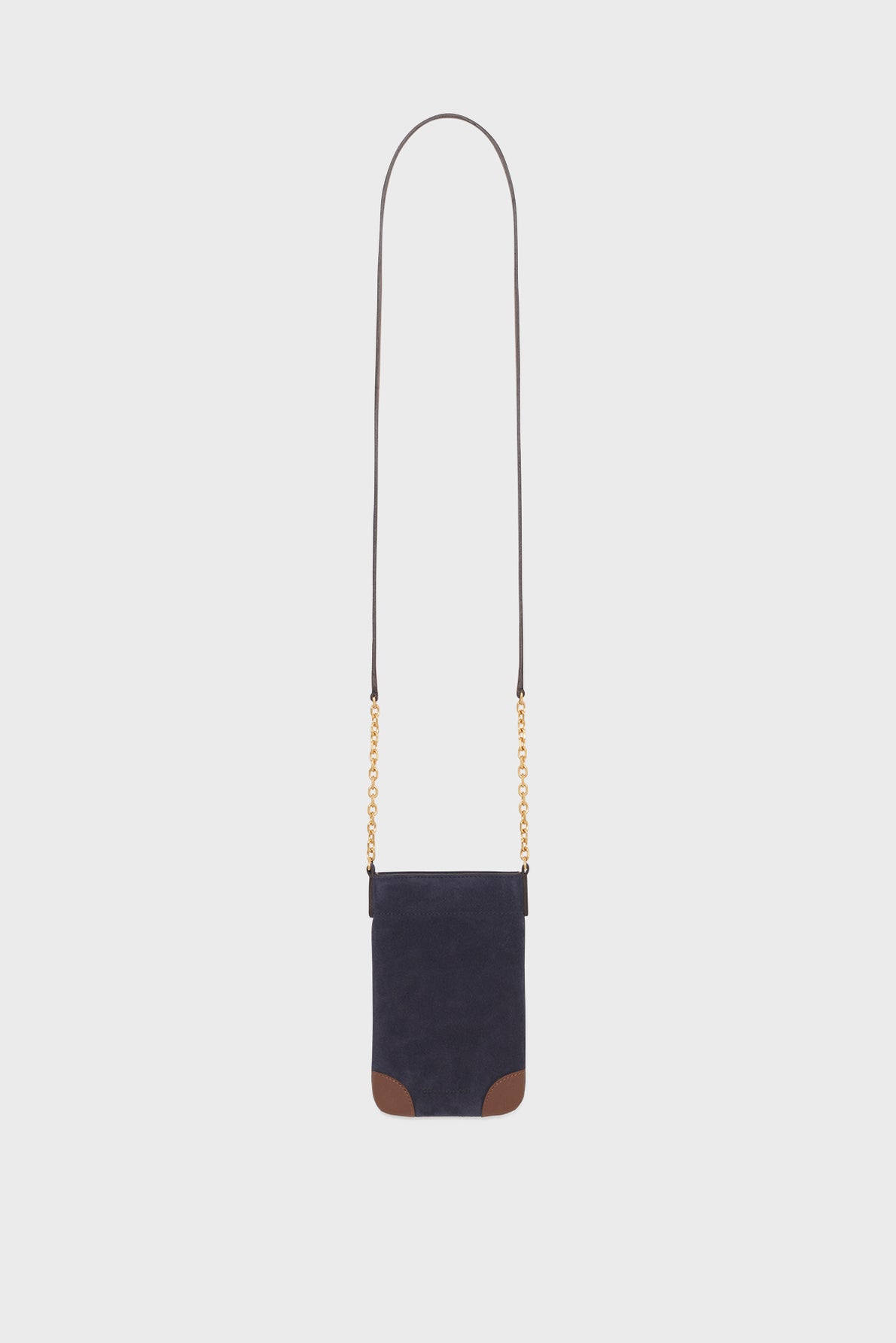 Small, navy blue cuir velours crossbody bag with a long leather strap, gold bandoulière chaîne accents, and brown leather corners at the bottom, displayed against a plain white background.