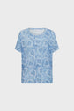 Light blue short-sleeve shirt with a white and blue paisley pattern, displayed on a plain white background. The shirt has a relaxed fit and a round neckline.