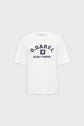 White coton T-shirt blanc à manches courtes with G. Darel and Saint-Tropez printed in navy blue text and a shield emblem on the chest, displayed on a light gray background.