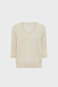 Beige, knit col V sweater with three-quarter length sleeves, displayed on a plain white background.