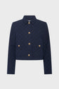Navy blue cropped jacket with a checkered pattern, gold buttons in two rows, a collar, and long sleeves. The jacket has a structured, tailored fit.