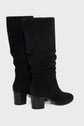 A pair of black suede knee-high boots with rounded toes and medium block heels, displayed on a light gray background.