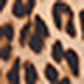 A close-up of an imprimé léopard pattern with black and dark brown spots on a light tan background.