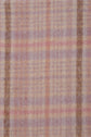 Soft fabric with a fuzzy texture and a pastel plaid pattern in shades of pink, purple, and beige, featuring intersecting vertical and horizontal stripes—this élégante écharpe à carreaux is the perfect accessory to add a touch of warmth and style to your look.