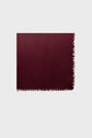 A rectangular maroon scarf with fringed edges, reminiscent of an élégante echarpe bordeaux, is laid flat on a light gray background.