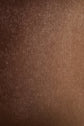 A close-up of a brown textured fabric surface, resembling an élégante écharpe marron, shows a soft, slightly mottled appearance with gentle shading and a subtle weave pattern, evoking the luxurious feel of an écharpe laine cachemire for femme.