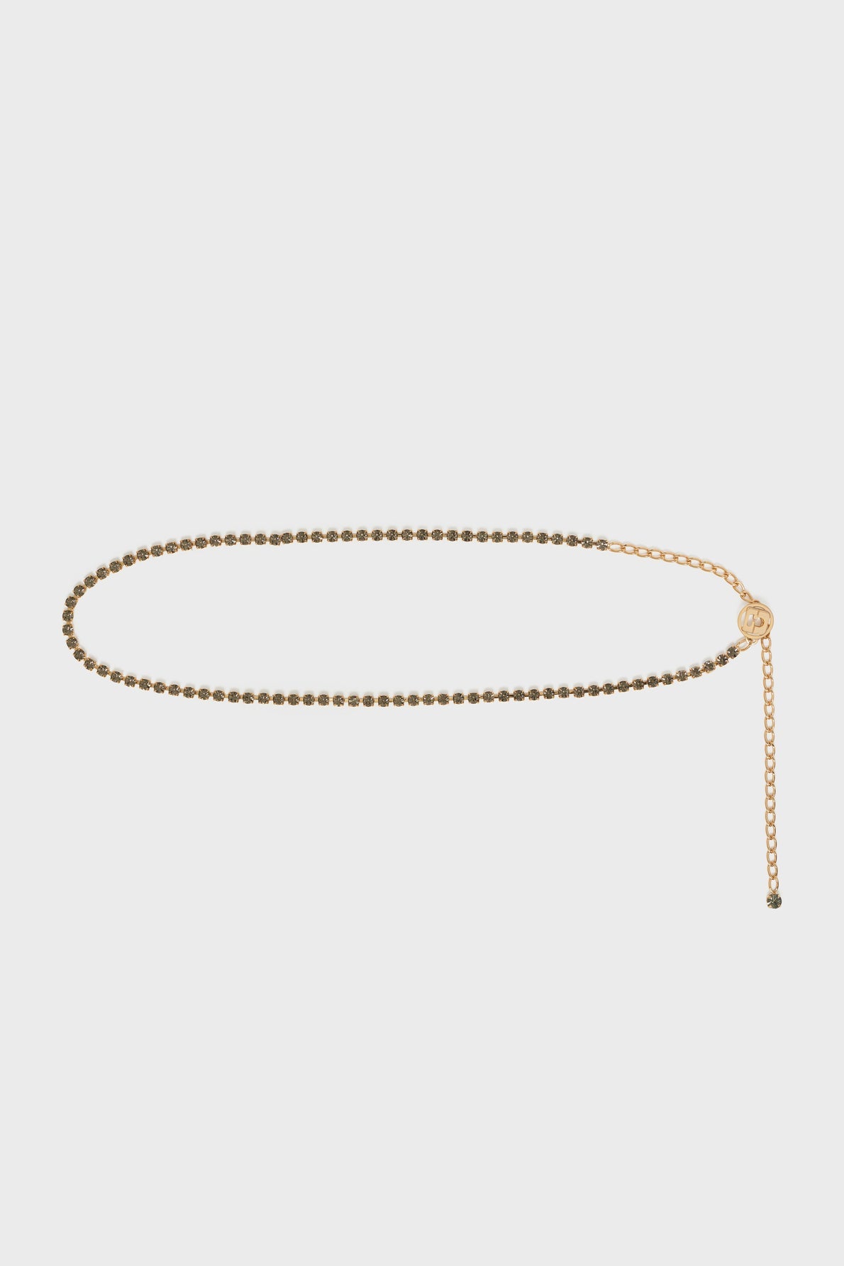 Gold beaded ceinture chaîne belt with an adjustable clasp and dangling chain extension, accented by a médaille GD adorned with strass gris bleuté, displayed on a plain white background.