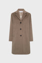 A long, brown manteau laine with a notched collar, three black buttons down the front, two side pockets, and beige lining, displayed against a plain white background.