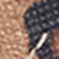 A close-up, blurry image showing a mix of tan and black textured surfaces with a thin, light-colored diagonal line separating the two areas, evoking the luxurious feel of toile enduite léopard—perfect for a charm de sac or a chic porte-clé panthère.