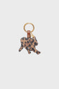 A gold keyring with a brown leather loop and a cat-shaped charm featuring a black and tan leopard print pattern, this elegant porte-clé panthère makes the perfect charm de sac for adding a touch of wild style to your everyday accessories.