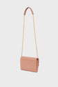 A pink rectangular handbag with a gold bandoulière chaîne cuir shoulder strap and a matching pink leather pad at the top, displayed against a plain white background—an accessoire tendance that elevates any look.