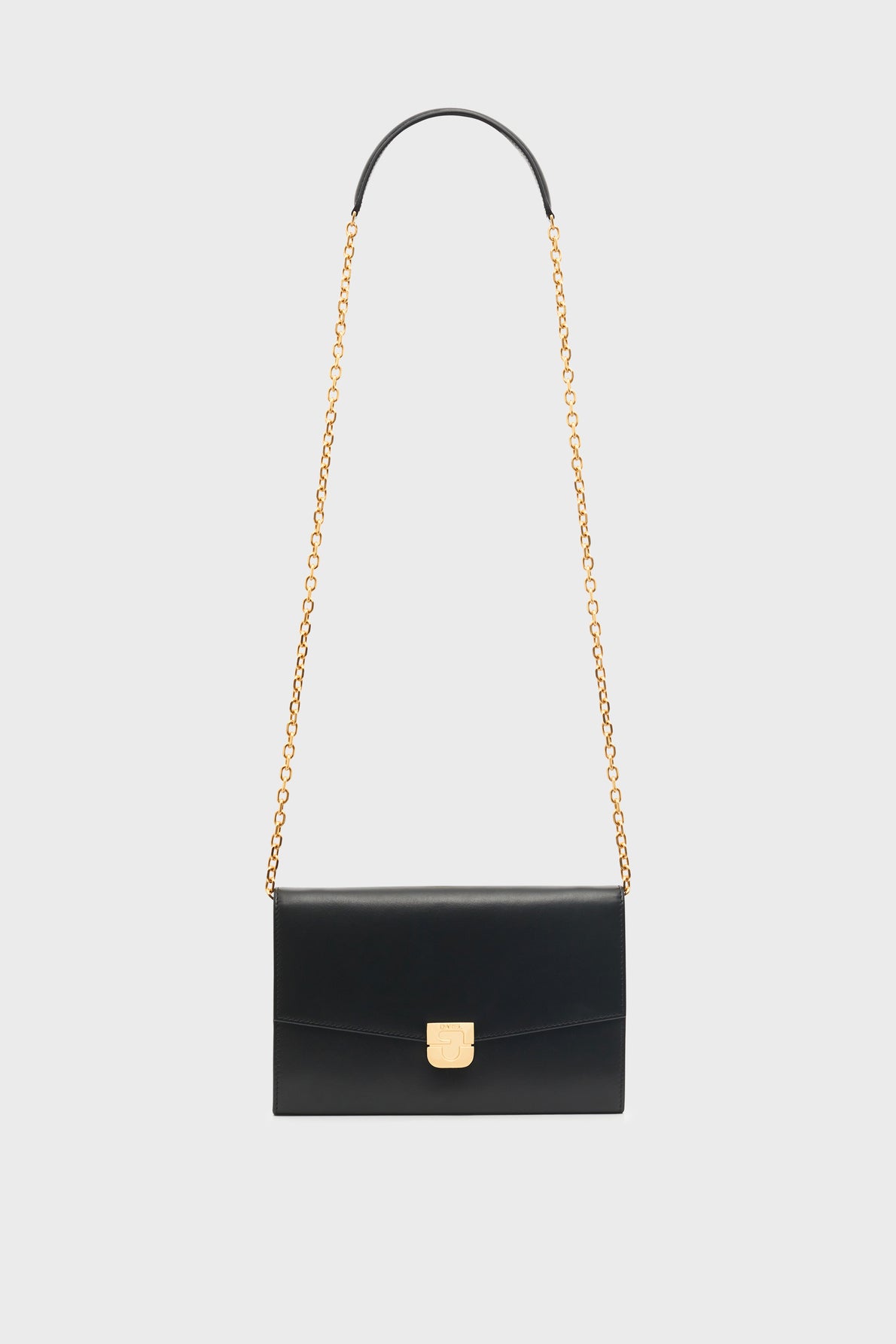 A black leather shoulder bag with a gold chain strap and a rectangular shape, featuring a gold clasp closure on the front, displayed against a plain white background—this sac bandoulière femme is the perfect accessoire tendance to elevate any outfit.